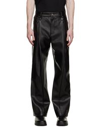 WOOYOUNGMI - Pantalon noir en cuir synthétique à plis - Lyst