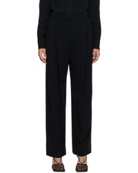 Victoria Beckham - Pantalon ample noir à plis - Lyst