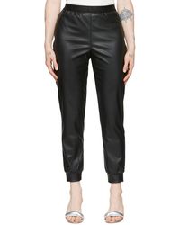 Pantalon Grazia à ceinture à logo Wolford en coloris Noir Femme Vêtements Pantalons décontractés élégants et chinos Pantalons coupe droite 