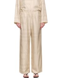 TOTEME - Pantalon De Détente Blanc Cassé En Soie À Monogrammes - Lyst