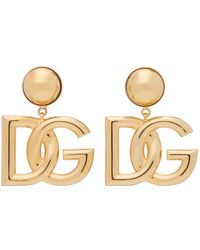 Femme Bijoux Boucles d’oreilles Boucles doreilles pendantes à éléments décoratifs Dolce & Gabbana en coloris Métallisé 