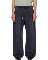 WOOYOUNGMI - One-Tuck Dyed Cotton Sweatpants - Lyst