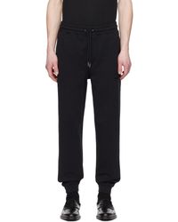 HUGO - Pantalon de survêtement noir à écusson à logo - Lyst