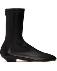 KHAITE - Apollo Flat Ankle Boots - Lyst