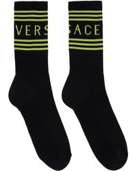 Versace - Chaussettes noires à logo rétro '90s - Lyst