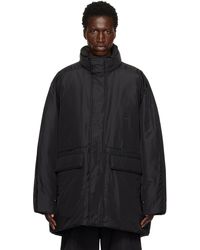WOOYOUNGMI - Blouson Noir Rembourré En Duvet À Col Cheminée - Lyst