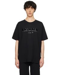 Balmain - T-shirt noir à logo métallique floqué - Lyst