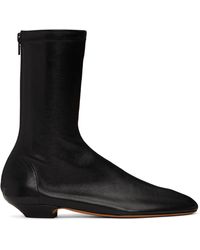 KHAITE - Apollo Flat Ankle Boots - Lyst