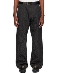 Versace - Jacquard Cotton Carpenter Trousers - Lyst