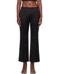 TOTEME - Kick Flare Raw-Edge Trousers - Lyst