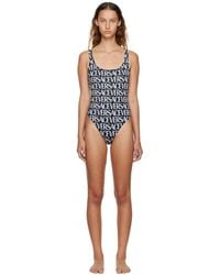 Versace - And White All-over Logo Print Swimsuit - Lyst