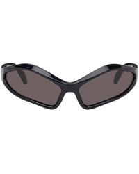 Balenciaga - Lunettes de soleil ovales fennec noires - Lyst