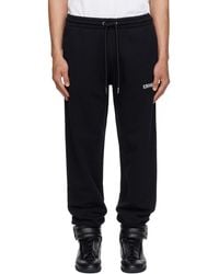 Off-White c/o Virgil Abloh - Heraldic Arrow Cuffed Sweatpants - Lyst