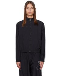 JW Anderson - Blouson de survêtement noir à rayures - Lyst