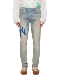Amiri - Staggered Logo Skinny Jeans - Lyst