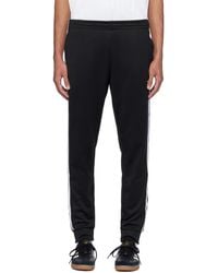 adidas Originals - Pantalon de survêtement noir à garnitures à trois rayures - Lyst