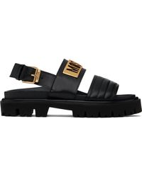 Moschino - Sandales noires en cuir de veau à ferrure à logo - Lyst