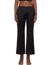 TOTEME - Kick Flare Raw-Edge Trousers - Lyst