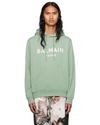 メンズ Balmain ーン ロゴプリント フーディ グリーン | Lyst