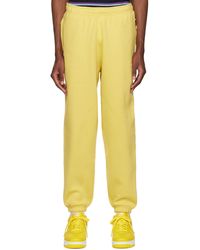 Nike - Yellow Embroidered Lounge Pants - Lyst