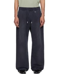 WOOYOUNGMI - One-Tuck Dyed Cotton Sweatpants - Lyst