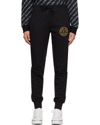 Versace - Pantalon de détente noir à logo circulaire - Lyst