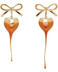 OTTOLINGER - Boucles D'Oreilles Doré Et À Ornements De Boucle Et De Cœur - Lyst