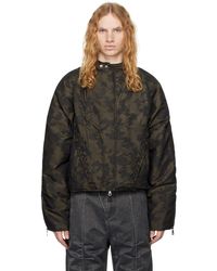 ANDERSSON BELL - Blouson Rembourré Vert À Motif Camouflage Et À Ornements Lacés - Lyst