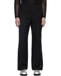 ANDERSSON BELL - Pantalon de survêtement noir à motif à rayures modifiées - Lyst