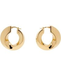 Bottega Veneta - Boucles d'oreilles à anneau torsadées dorées - Lyst
