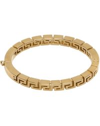 Versace - Bracelet jonc doré à motif à clé grecque - Lyst