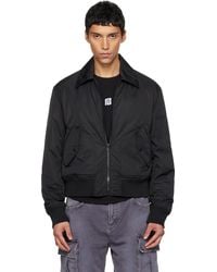 Balmain - ブラック Big Stamp ボンバージャケット - Lyst