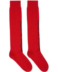 Femme Vêtements Chaussettes & Bas Chaussettes Chaussettes s à logo Synthétique Comme des Garçons en coloris Rouge 