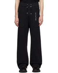 Balmain - Pantalon de survêtement noir à appliqué à logo métallique - Lyst