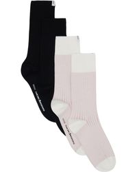 Socksss - Ensemble de deux paires de chaussettes roses et noires en tricot côtelé - Lyst