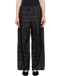 TOTEME - Pantalon De Détente De Style Pyjama Noir En Soie À Monogrammes - Lyst