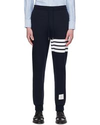 Thom Browne - Thom e pantalon de survêtement bleu marine à quatre rayures - Lyst