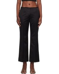 TOTEME - Kick Flare Raw-Edge Trousers - Lyst