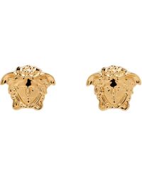 Versace - Boucles d'oreilles dorées à méduse - Lyst