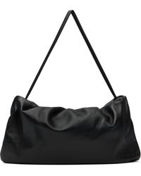 The Row - Très Grand Sac Bourse Noir - Lyst