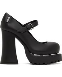 Moschino - Chaussures à talon bottier noires à étiquette à logo - Lyst