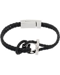 Ferragamo - Bracelet noir en cuir tressé à ornement gancini - Lyst