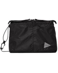 and wander - Sac messager sil noir - Lyst