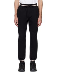 BOSS - Pantalon de survêtement noir garnitures à rayures - Lyst