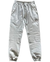 Amiri - Staggered Logo Sweatpants Aw23Mjp005 032" - Lyst
