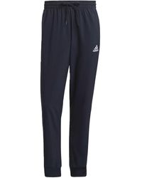 adidas - Essentials Tapered Cuff Woven 3-Stripes Pants "Legend Ink" Gk8981" - Lyst
