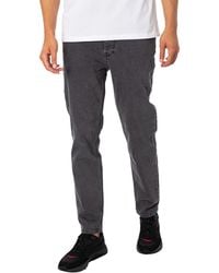 HUGO - 634 Tapered Fit Jeans - Lyst