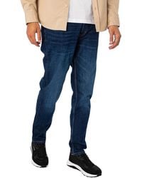 HUGO - 634 Tapered Jeans - Lyst