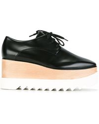 Dames Schoenen voor voor Hakken voor Sleehakken en pumps Stella McCartney Leer Elyse Platform Shoes in het Zwart 