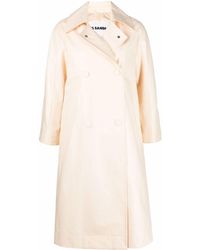 Womens Clothing Coats Raincoats and trench coats Jil Sander Belted Double-breasted Trench Coat in Orange 